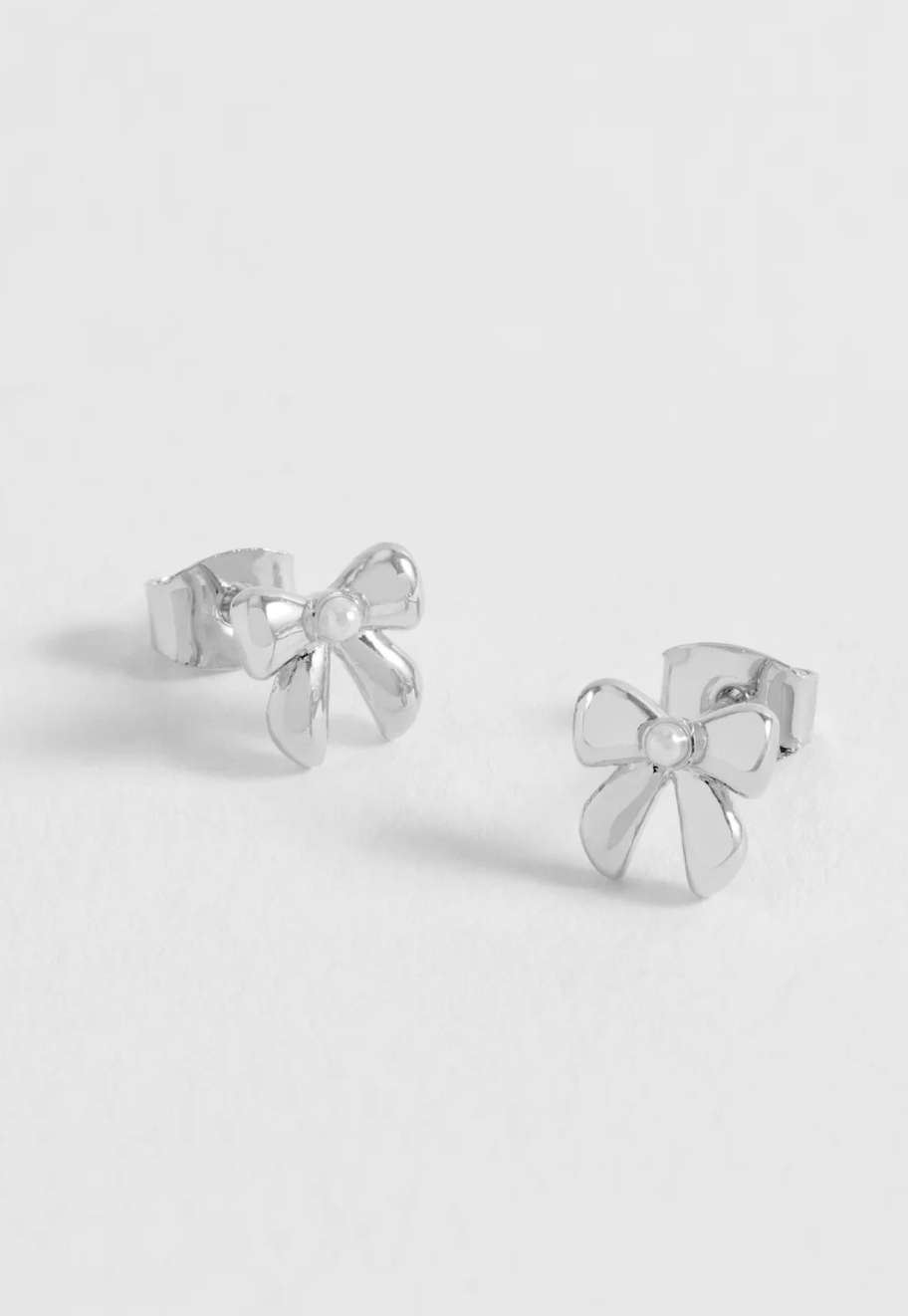 Estella Bartlett Pearl Bow Studs Silver
