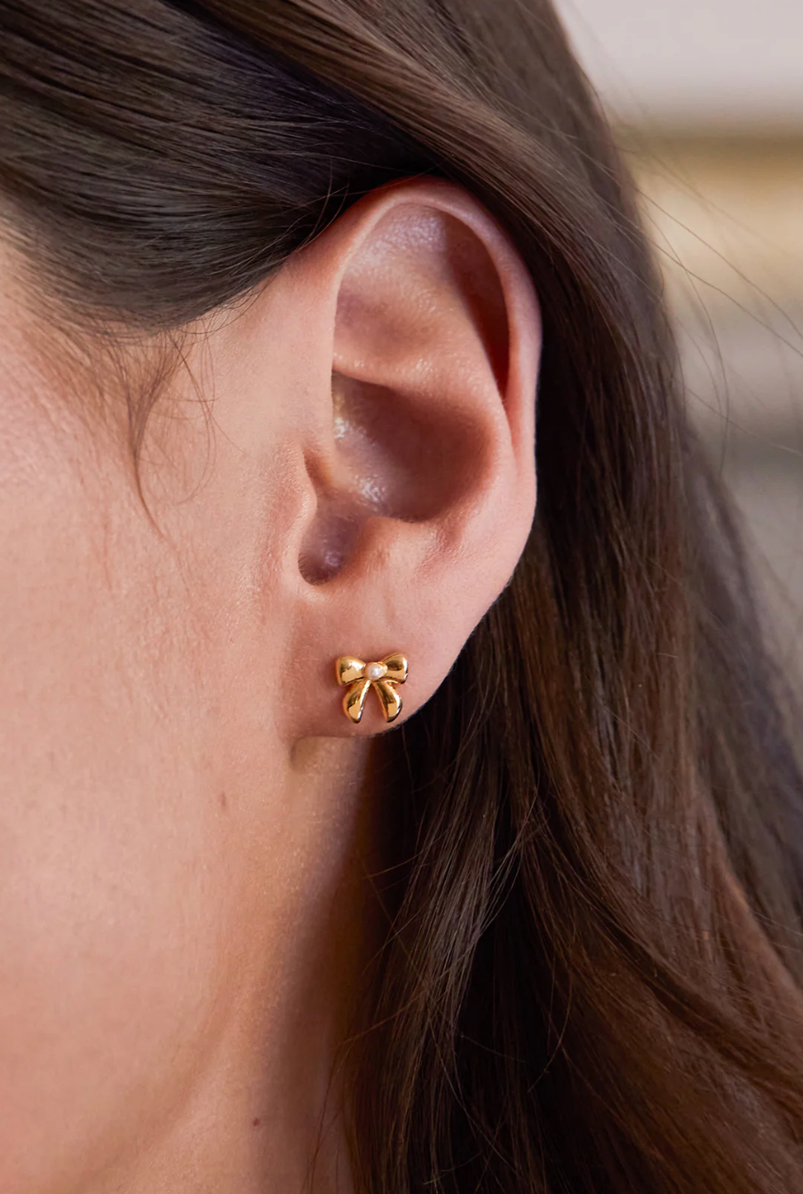 Estella Bartlett Pearl Bow Studs Gold